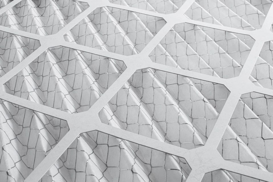 Clean MERV air filter close-up showing filtration media