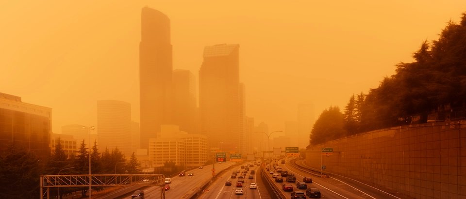 Los Angeles highway obscured by wildfire smoke and orange haze